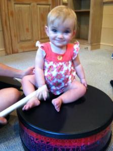 Charlie climbed on the drum in music therapy.